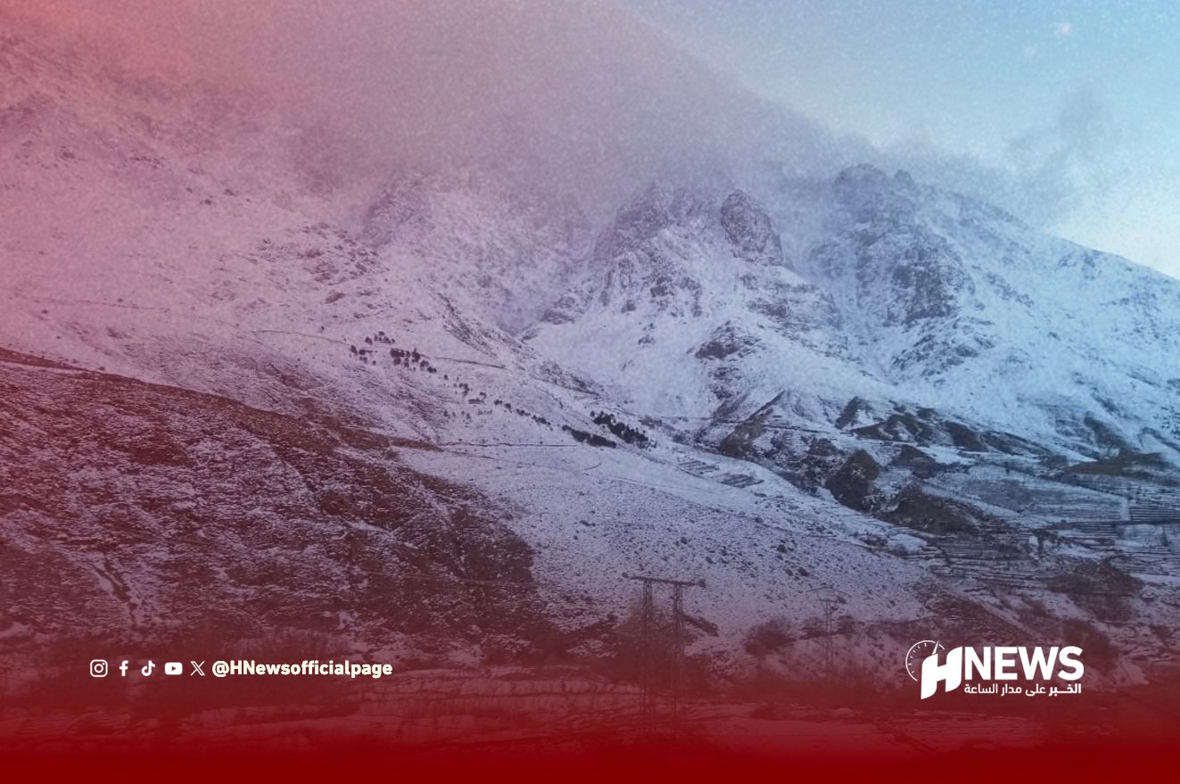 Snow-covered mountain range with a red gradient overlay; HNews watermark bottom right.