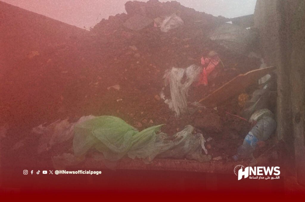 نفايات الدواجن | H-NEWS آش نيوز Pile of dirt and trash with scattered fabric and plastic debris at a construction or dumping area; red overlay and HNews logo at bottom right.