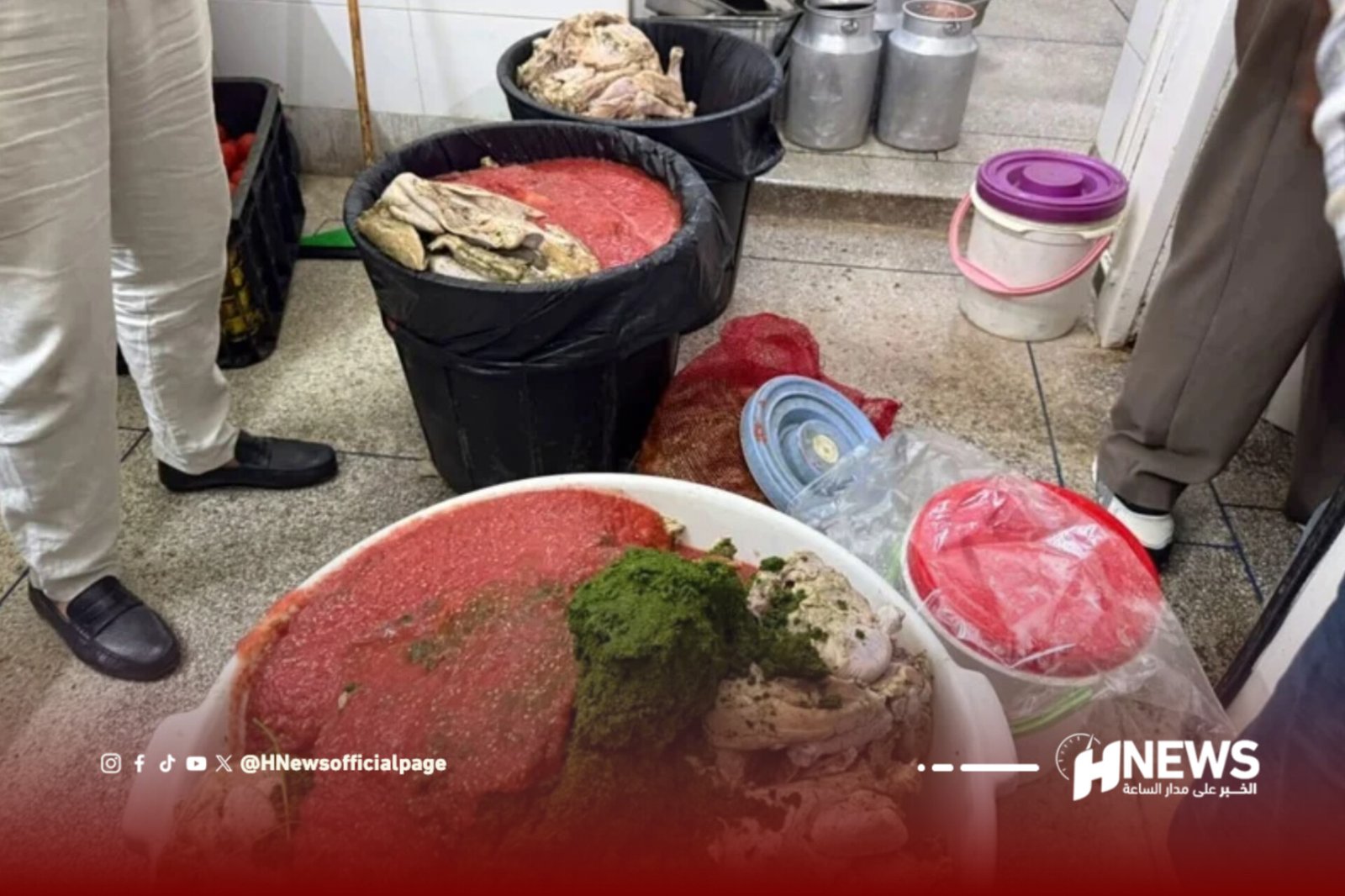 Buckets of raw meat and fish scraps in a market, with people standing nearby and metal containers in the background.